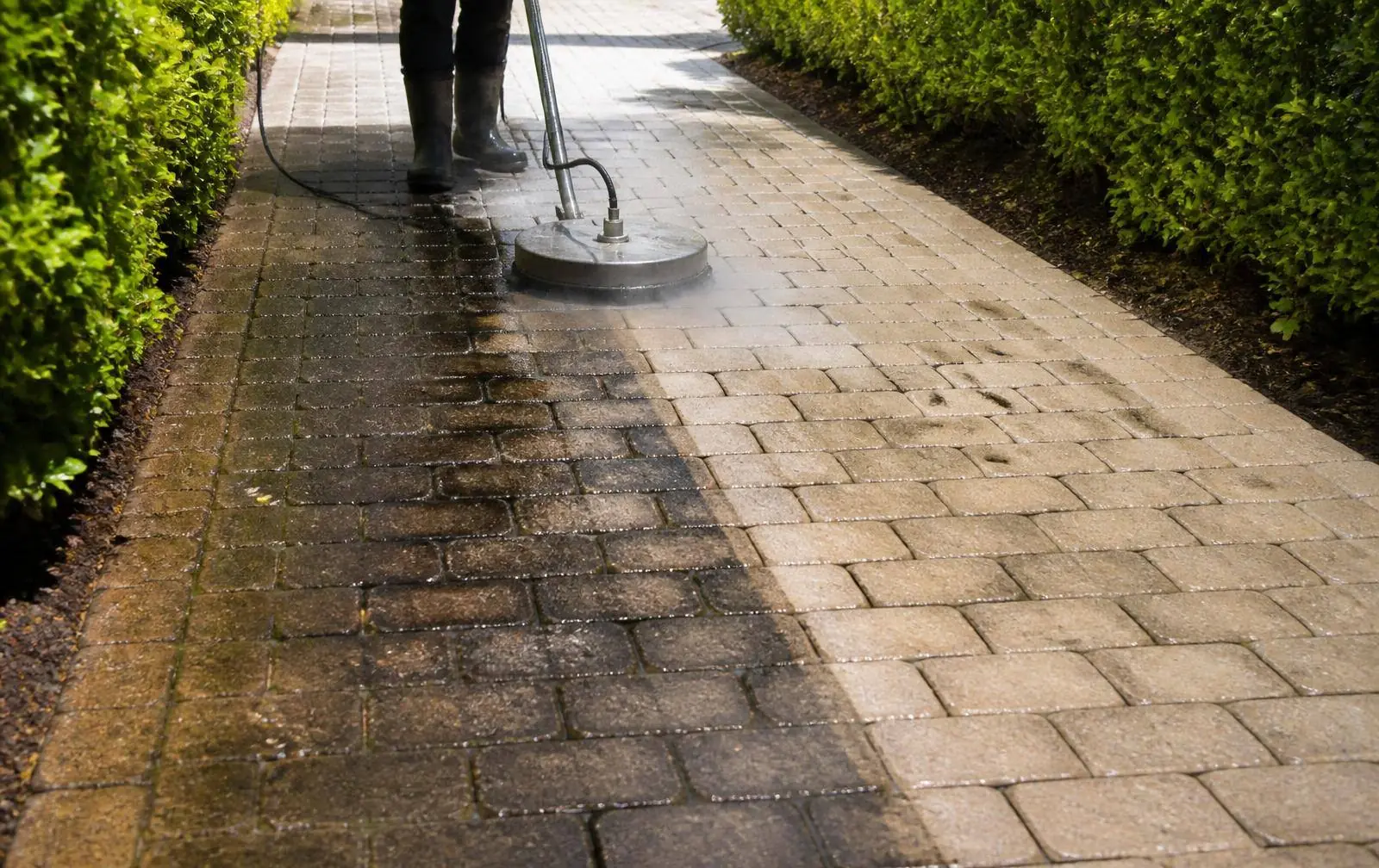 Driveway pavers before and after professional pressure washing